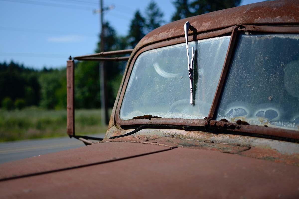car mirror closed-up image of red car antique